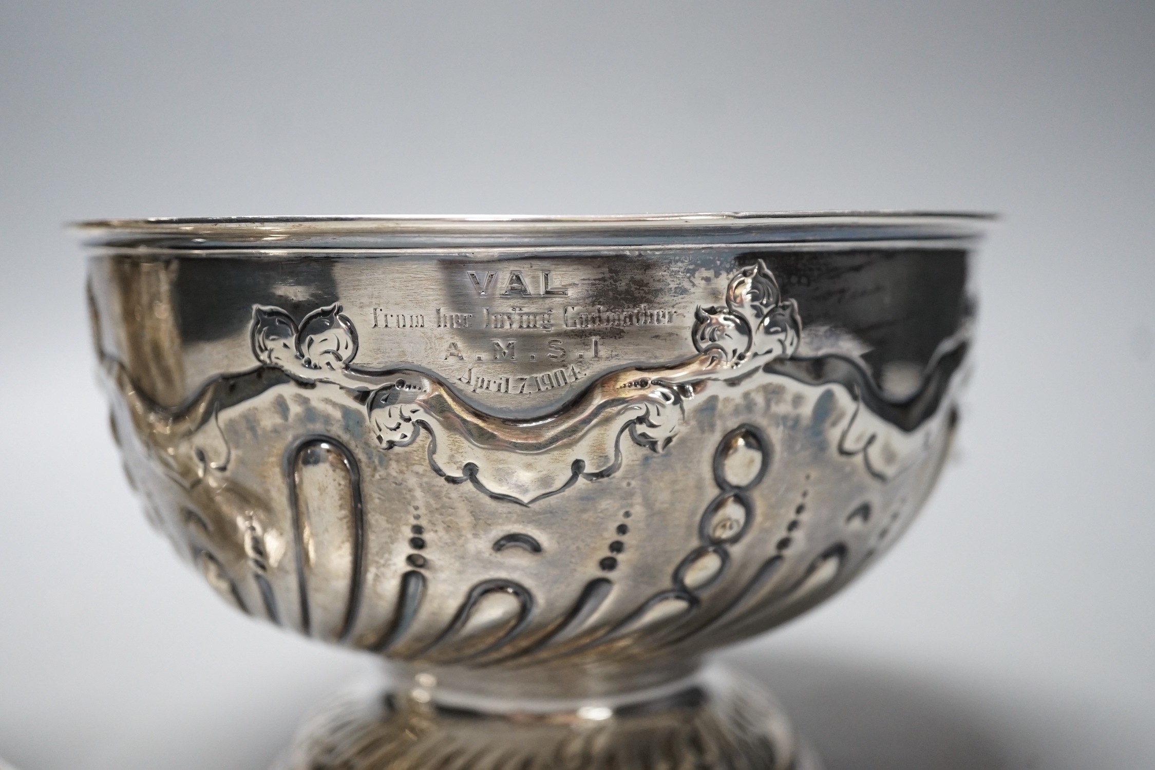 A late Victorian silver lighthouse sugar caster, Birmingham, 1893, 17.3cm and similar repousse rose bowl, 13.4oz.